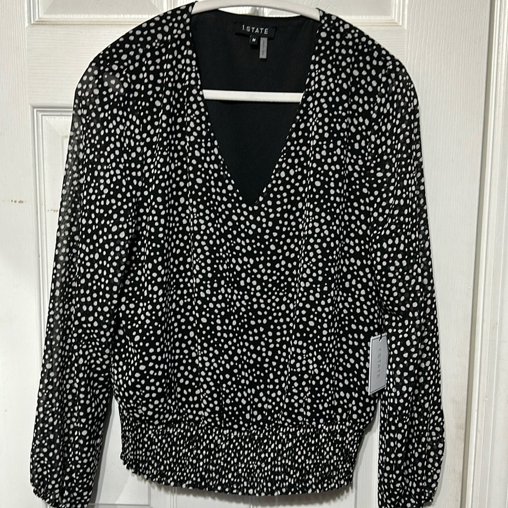 Black with white polkadot shirt